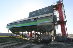 A seeds treatment center. A wheat storage. Acros combine harvesters, manufactured by Rostselmash OJSC, during the summer wheat harvest on a farm operated by 'Svetlyi" Group of Companies, in Kamenka village, outside Rostov, Russia, July 5, 2019. http://gk-svetlyi.ru/