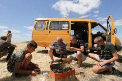 Lunchtime. Acros combine harvesters, manufactured by Rostselmash OJSC, during the summer wheat harvest on a farm operated by 'Svetlyi" Group of Companies, in Kamenka village, outside Rostov, Russia, July 5, 2019. http://gk-svetlyi.ru/