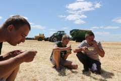 Lunchtime. Acros combine harvesters, manufactured by Rostselmash OJSC, during the summer wheat harvest on a farm operated by 'Svetlyi" Group of Companies, in Kamenka village, outside Rostov, Russia, July 5, 2019. http://gk-svetlyi.ru/